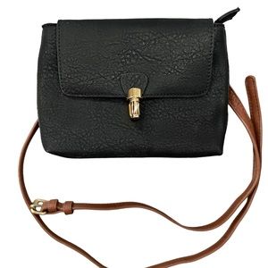 Black faux leather belt bag with brown trim